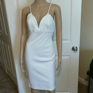 Sexy white low cut form fitting midi dress.